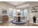 Bright dining room with modern chandelier and access to outdoor space at 504 N Park N Ave # 4, Indianapolis, IN 46202