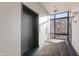 Hallway view with an elevator, large window, and patterned carpeting at 504 N Park N Ave # 4, Indianapolis, IN 46202