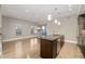 Open floor plan with granite island in kitchen, flowing into a spacious living area at 504 N Park N Ave # 4, Indianapolis, IN 46202