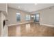 Bright open living room with fireplace, hardwood floors, and large windows at 504 N Park N Ave # 4, Indianapolis, IN 46202