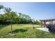 Expansive backyard featuring a well-maintained lawn, a playground, and a patio with pergola at 5573 Mahogany Dr, Noblesville, IN 46062
