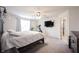 Relaxing main bedroom features a ceiling fan, television, and an ensuite bathroom at 5573 Mahogany Dr, Noblesville, IN 46062