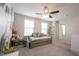 Bright bedroom with a pull-out daybed, decorative wallpaper, and built-in shelving for books and toys at 5573 Mahogany Dr, Noblesville, IN 46062