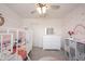 Bright bedroom featuring a house frame bed, white dresser, and rainbow wall decorations at 5573 Mahogany Dr, Noblesville, IN 46062