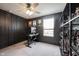 Stylish bedroom with dark accent wall, Star Wars art, and collectible display at 5573 Mahogany Dr, Noblesville, IN 46062