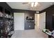 Bedroom featuring custom millwork wall, display shelving, and access to another room at 5573 Mahogany Dr, Noblesville, IN 46062