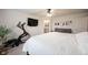 Inviting main bedroom features a ceiling fan, an exercise bike, and a television at 5573 Mahogany Dr, Noblesville, IN 46062