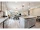 Open concept living area with kitchen, dining area, and living room featuring a fireplace at 5573 Mahogany Dr, Noblesville, IN 46062