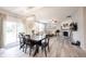 Open-concept living and dining area with modern lighting and seamless flow to the kitchen at 5573 Mahogany Dr, Noblesville, IN 46062