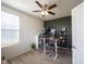 Office space with ceiling fan, wood desk, and view of the window at 5573 Mahogany Dr, Noblesville, IN 46062
