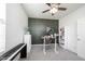 Modern home office featuring gray carpet, stylish furnishings, accent wall, and abundant natural light at 5573 Mahogany Dr, Noblesville, IN 46062