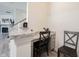 Built in desk area with chair and granite counter located near the kitchen at 5573 Mahogany Dr, Noblesville, IN 46062