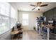 Office space with neutral walls, ceiling fan, wood desk, and large windows at 5573 Mahogany Dr, Noblesville, IN 46062