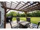Outdoor patio with pergola, string lights, comfortable seating, and a grill at 5573 Mahogany Dr, Noblesville, IN 46062