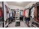 Walk-in closet featuring built-in shelving for shoes, clothes, and accessories at 5573 Mahogany Dr, Noblesville, IN 46062