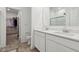 Bathroom features a dual sink and a walk-in closet at 10008 Sundley Dr, Indianapolis, IN 46239