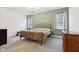 Stylish bedroom with a chandelier at 10008 Sundley Dr, Indianapolis, IN 46239