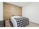 Bedroom with wood-look accent wall at 10008 Sundley Dr, Indianapolis, IN 46239