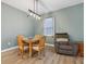 Cozy dining area with a modern light fixture and a comfortable accent chair at 10008 Sundley Dr, Indianapolis, IN 46239