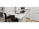 Modern kitchen featuring stainless steel appliances, white cabinets, and a kitchen island at 10008 Sundley Dr, Indianapolis, IN 46239