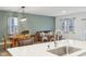 Open living space featuring a dining area and living room connected to a modern kitchen at 10008 Sundley Dr, Indianapolis, IN 46239