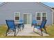 A backyard patio featuring a table and chairs, perfect for enjoying outdoor meals at 10008 Sundley Dr, Indianapolis, IN 46239