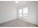 Bright, carpeted bedroom featuring natural light from the dual windows at 15846 Vitalize Run, Fishers, IN 46040
