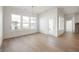 Bright dining room featuring large windows and light wood floors at 15846 Vitalize Run, Fishers, IN 46040