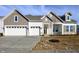 Beautiful home exterior featuring a three-car garage and stone accents, blending style and functionality at 15846 Vitalize Run, Fishers, IN 46040