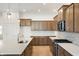 Bright kitchen featuring wood cabinets, stainless appliances, tile backsplash, marble countertops and island at 15846 Vitalize Run, Fishers, IN 46040