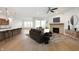 Contemporary living space with stylish furniture, fireplace, and integrated kitchen, creating a sophisticated ambiance at 15846 Vitalize Run, Fishers, IN 46040