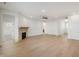 Spacious open-concept living area featuring a stone fireplace, abundant natural light, and modern flooring at 15846 Vitalize Run, Fishers, IN 46040