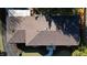 Aerial view of a house with brick roof, walkway, patio, and landscaping at 6906 Johnson Rd, Indianapolis, IN 46220