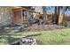 Backyard space with patio, fire pit, and landscaping, offering an outdoor retreat for entertaining at 6906 Johnson Rd, Indianapolis, IN 46220