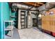 Utility basement with essential equipment, shelving and ample room for storage or future improvements at 6906 Johnson Rd, Indianapolis, IN 46220