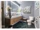 Modern bathroom featuring a dual-sink vanity, decorative mirror, modern toilet, and stylish accents at 6906 Johnson Rd, Indianapolis, IN 46220