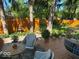 Inviting deck with outdoor seating area, surrounded by lush greenery and a charming water fountain at 6906 Johnson Rd, Indianapolis, IN 46220
