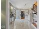 Elegant foyer featuring marble floors and an open staircase with natural light at 6906 Johnson Rd, Indianapolis, IN 46220