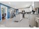 Bright kitchen featuring white cabinets, stainless steel appliances, and a central island with seating at 6906 Johnson Rd, Indianapolis, IN 46220