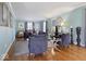 Cozy living room with hardwood floors, decorative mirrors, and comfortable seating at 6906 Johnson Rd, Indianapolis, IN 46220