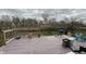 Rustic wood back deck with backyard grill and outdoor toys and play area at 5325 Bluff View Dr, Indianapolis, IN 46217