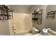 Modest bathroom featuring a toilet, and a shower with metal shelving at 5325 Bluff View Dr, Indianapolis, IN 46217