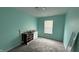 Standard bedroom featuring light blue walls, grey carpet and a window with blinds at 5325 Bluff View Dr, Indianapolis, IN 46217