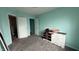 Standard bedroom featuring light blue walls, grey carpet and two entryways at 5325 Bluff View Dr, Indianapolis, IN 46217