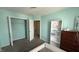 Standard bedroom featuring light blue walls, grey carpet and two entryways at 5325 Bluff View Dr, Indianapolis, IN 46217