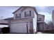 Two-story home featuring a large two car garage and light-colored siding at 5325 Bluff View Dr, Indianapolis, IN 46217