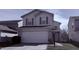 Two-story home featuring a large two car garage and light-colored siding at 5325 Bluff View Dr, Indianapolis, IN 46217