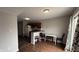 Kitchen with breakfast bar, cabinets, and adjacent eating area at 5325 Bluff View Dr, Indianapolis, IN 46217