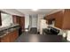 U-shaped kitchen with dark cabinets and laminate countertops at 5325 Bluff View Dr, Indianapolis, IN 46217