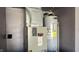 Mechanical room with furnace and hot water heater at 5325 Bluff View Dr, Indianapolis, IN 46217